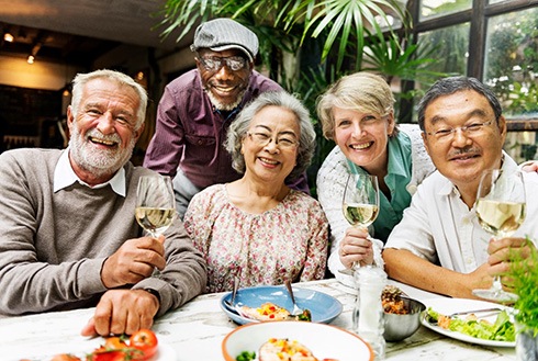 Dentures patients in Westerville smiling with friends