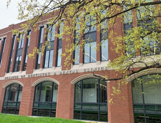 Front of academic building with sign reading College of Dentistry and Dental Clinics