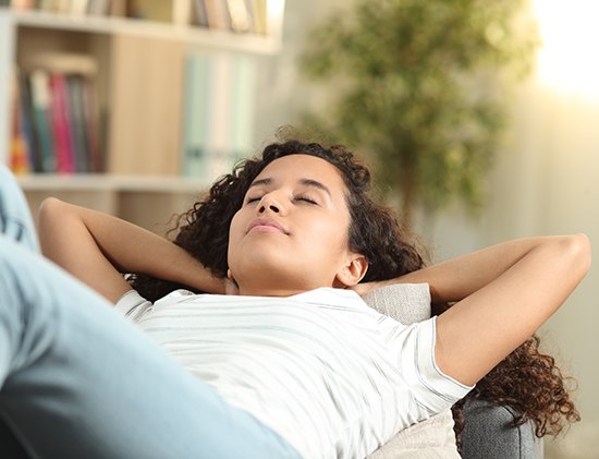 Woman resting on a couch