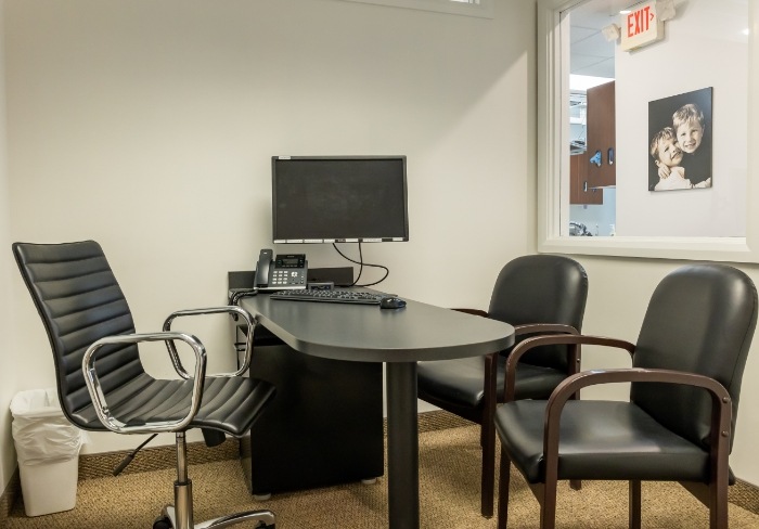 Dental conference room with desk and computer