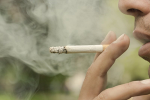 Close up of a man smoking a cigarette 